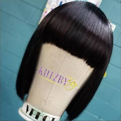 Blunt bob wig on a mannequin head with the KutzByKay logo
